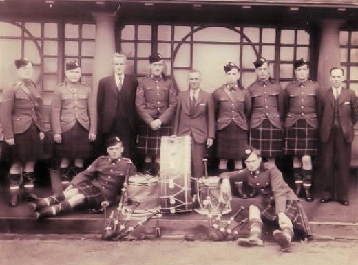 Jock Rogers and others with a military band in the Christie Park